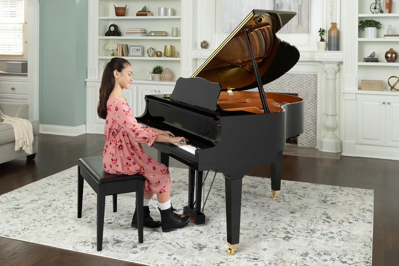 A Yamaha grand piano in a bright living room
